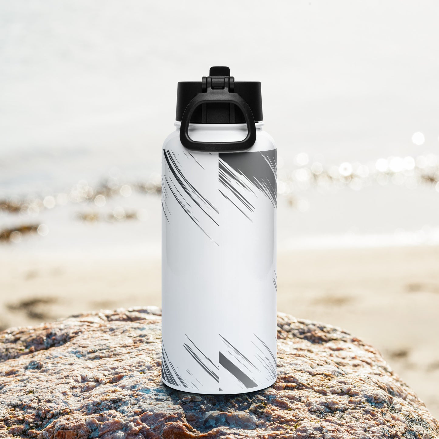 Stainless steel water bottle with a straw lid